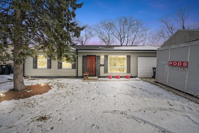 view of front of property with a garage