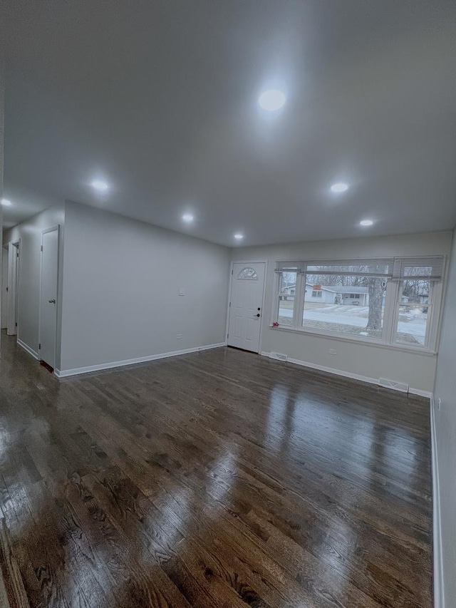 spare room featuring dark hardwood / wood-style flooring