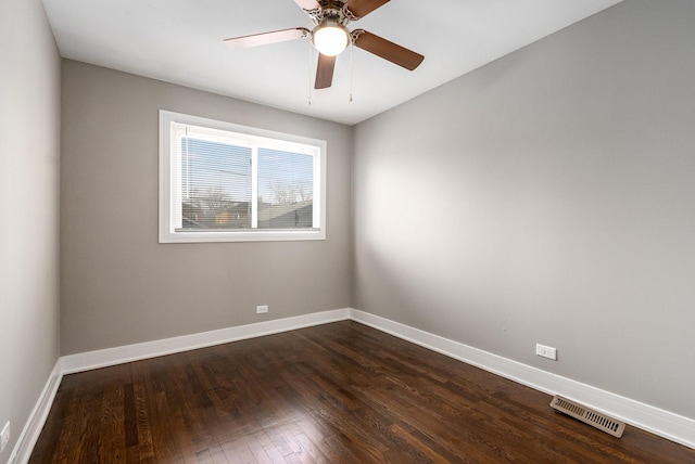 unfurnished room featuring ceiling fan and dark hardwood / wood-style flooring