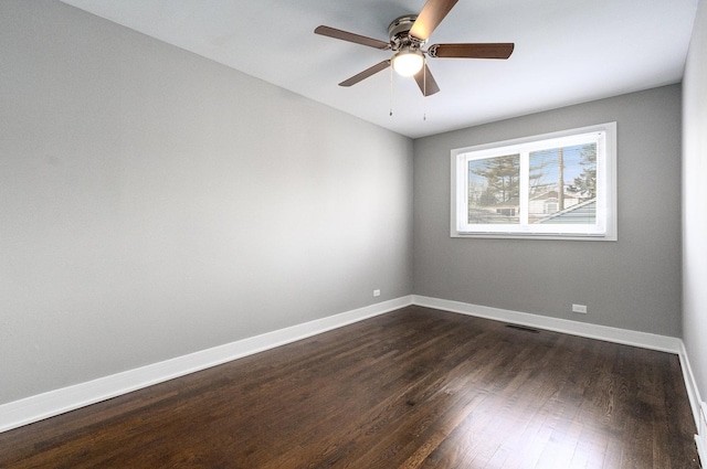 unfurnished room with dark hardwood / wood-style floors and ceiling fan