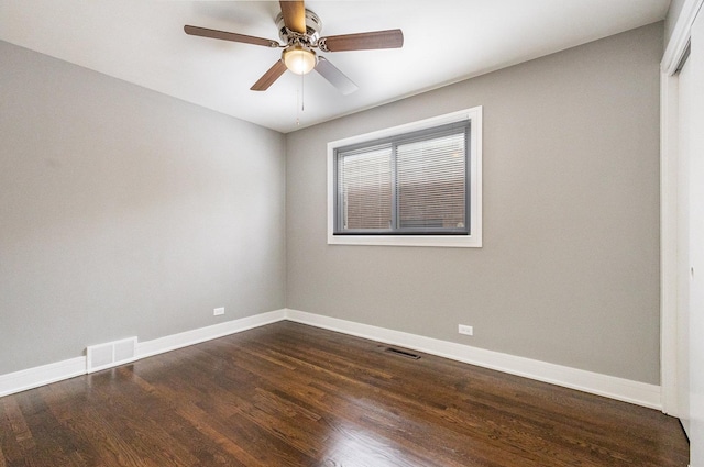 unfurnished room featuring dark hardwood / wood-style floors and ceiling fan