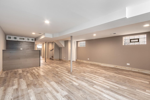 basement featuring light wood-type flooring