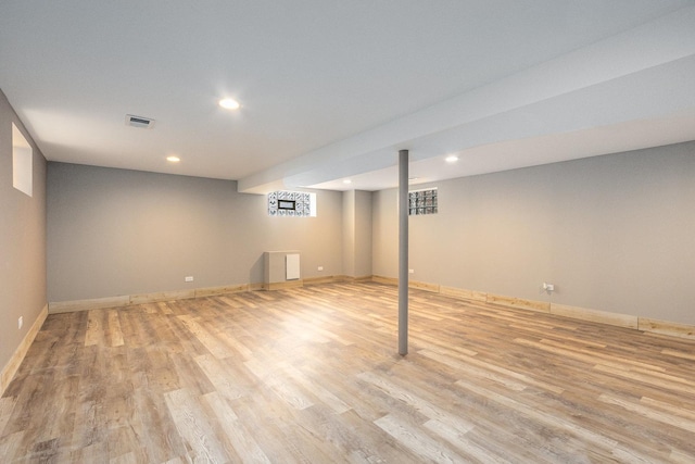 basement featuring light hardwood / wood-style floors