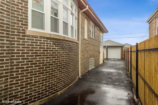 view of home's exterior featuring an outbuilding and a garage