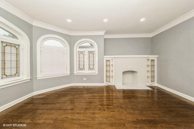 unfurnished living room with crown molding and dark hardwood / wood-style floors