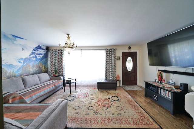 living room with an inviting chandelier and wood-type flooring