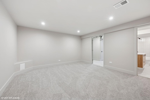 spare room with light carpet