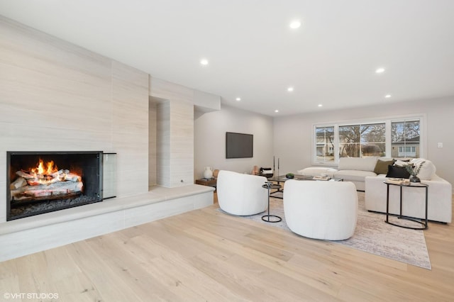 unfurnished living room with light hardwood / wood-style floors and a premium fireplace