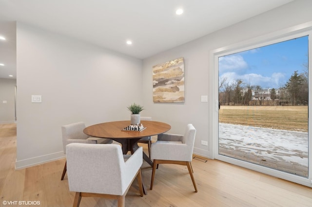 dining area featuring light wood-type flooring