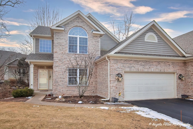 front of property with a garage