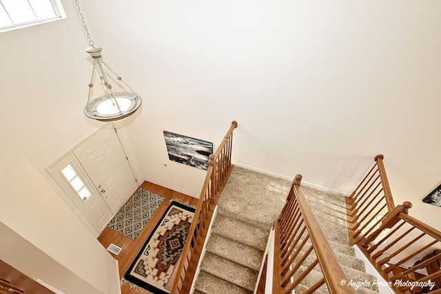 staircase featuring wood-type flooring