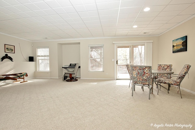 sitting room featuring crown molding and carpet