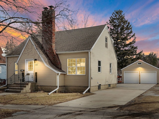 view of front of house with an outbuilding and a garage