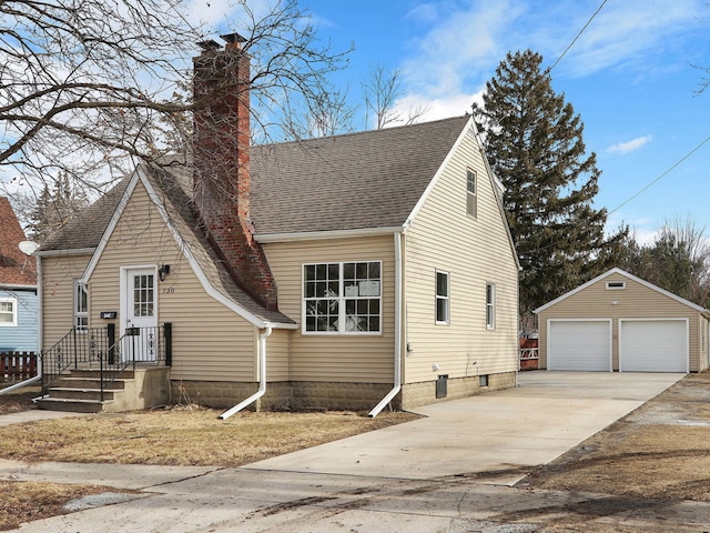 view of front facade with an outbuilding and a garage