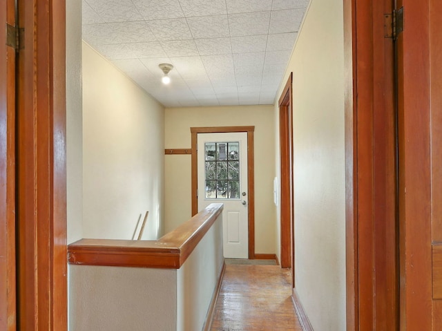 corridor with light wood-type flooring