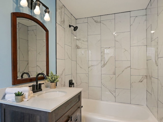 bathroom featuring vanity and tiled shower / bath combo