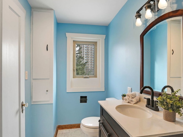 bathroom with vanity and toilet