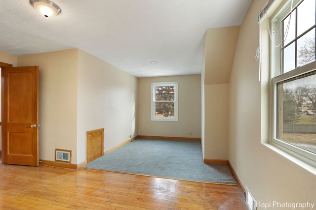 unfurnished room with light hardwood / wood-style floors