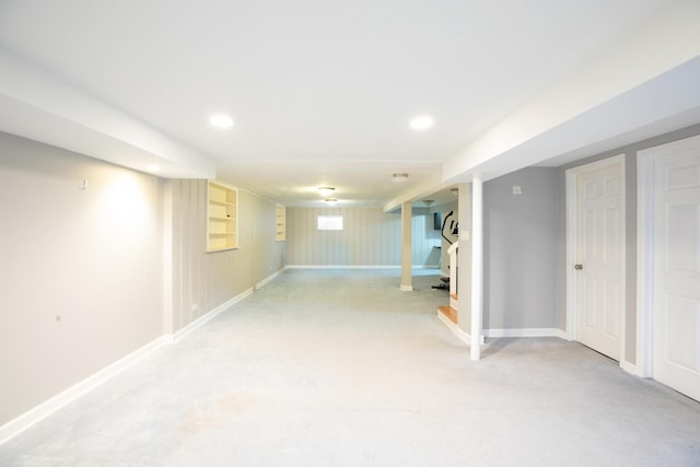 basement featuring light colored carpet