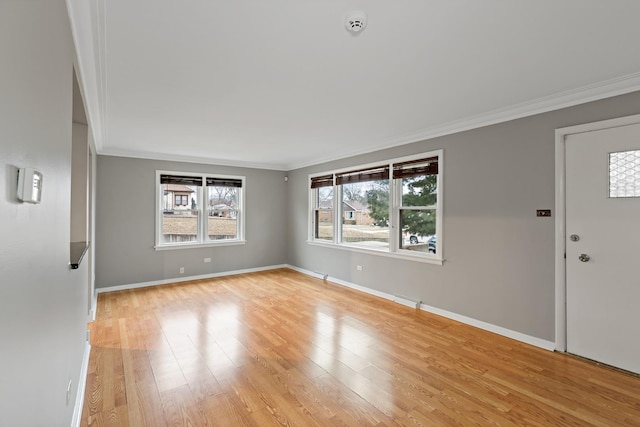 entryway featuring crown molding and light hardwood / wood-style floors