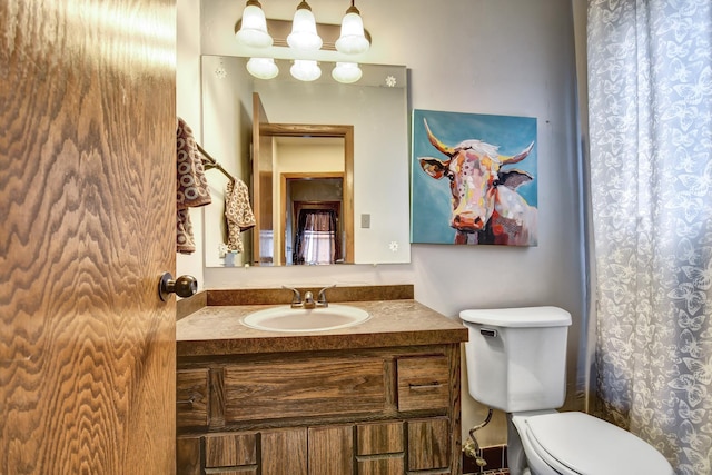 full bathroom with vanity and toilet