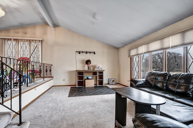 living room with vaulted ceiling with beams, baseboards, and carpet floors