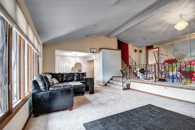 carpeted living room with vaulted ceiling with beams, stairway, and baseboards