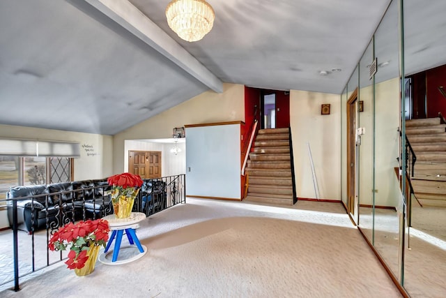 interior space with a chandelier, carpet floors, baseboards, and stairs