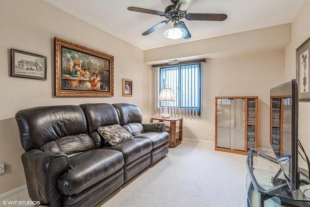 living room featuring carpet and ceiling fan