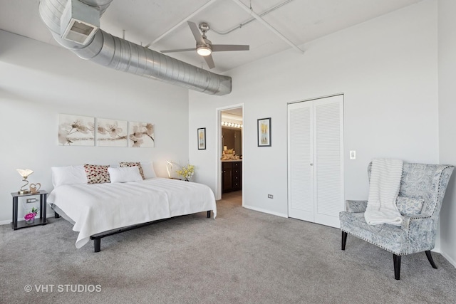 carpeted bedroom featuring connected bathroom, a closet, and ceiling fan