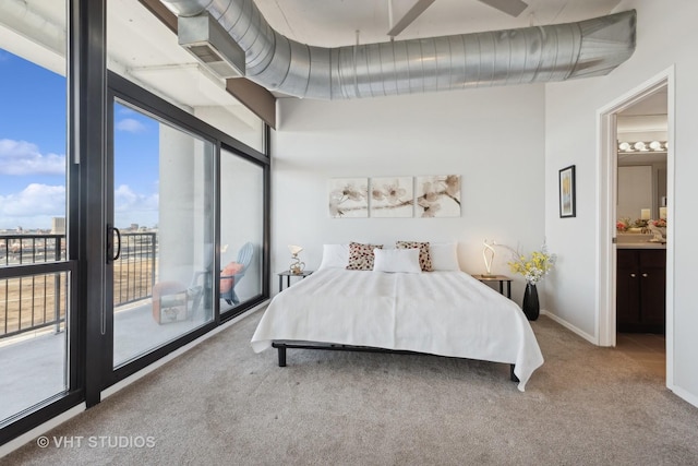 bedroom with access to outside and carpet flooring