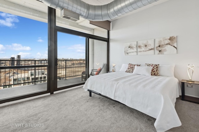 carpeted bedroom featuring access to outside