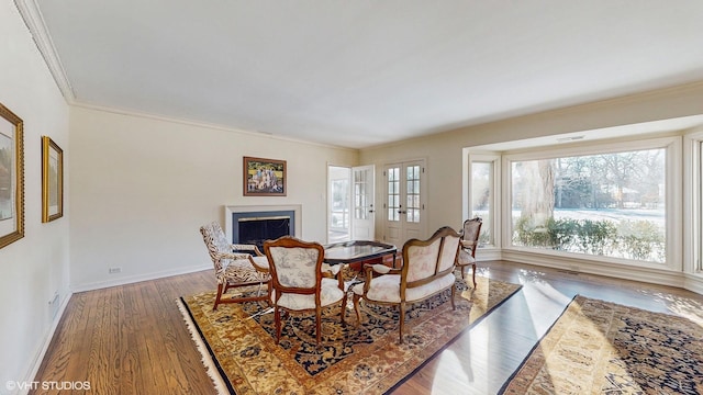 dining space with crown molding and dark hardwood / wood-style floors