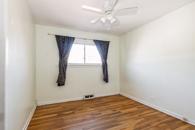 spare room featuring ceiling fan and dark hardwood / wood-style flooring