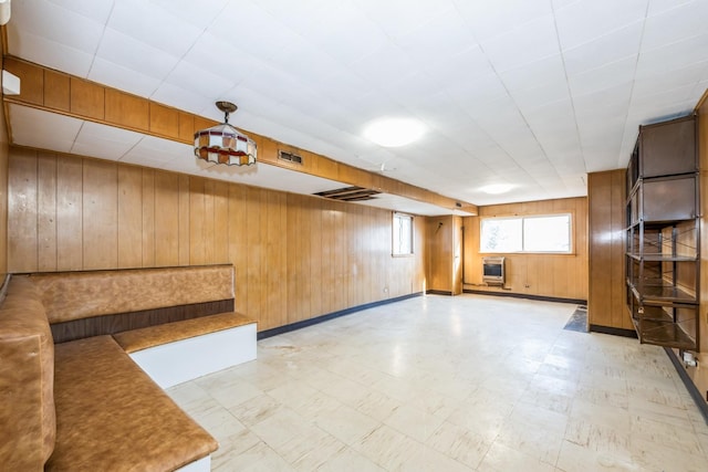 interior space with heating unit and wooden walls