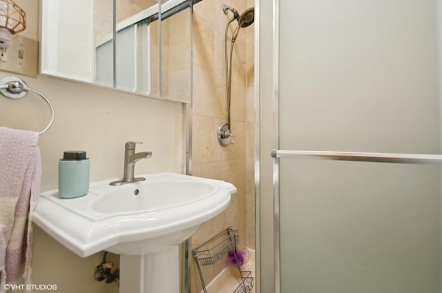 bathroom with sink and walk in shower