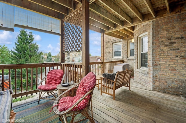 wooden terrace featuring an outdoor living space