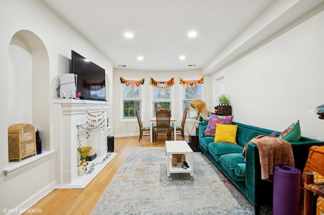 living room with light hardwood / wood-style flooring