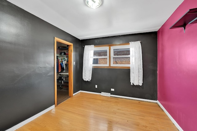 empty room featuring wood-type flooring