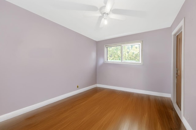 unfurnished room with hardwood / wood-style floors and ceiling fan