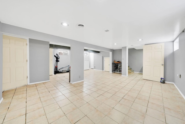 basement with light tile patterned flooring