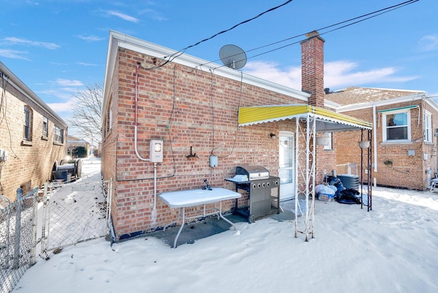 view of snow covered house