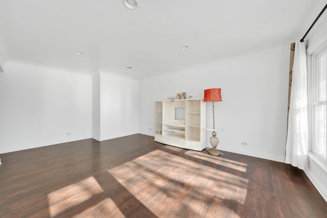 unfurnished room featuring ornamental molding and dark hardwood / wood-style floors