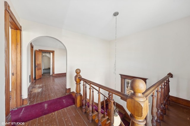 hallway with dark hardwood / wood-style floors