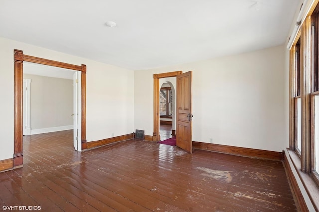 empty room with dark wood-type flooring