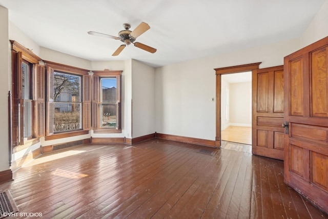 unfurnished living room featuring dark hardwood / wood-style floors and ceiling fan