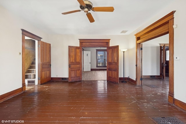 interior space with dark hardwood / wood-style flooring and ceiling fan