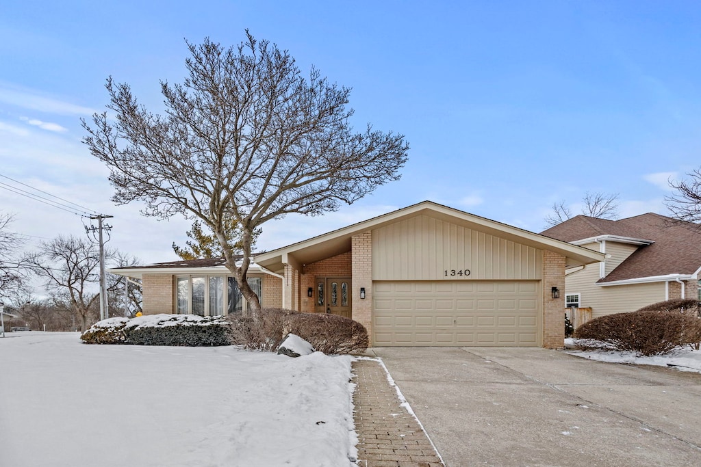 single story home featuring a garage