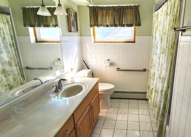 bathroom with tile walls, vanity, baseboard heating, toilet, and a shower with shower curtain