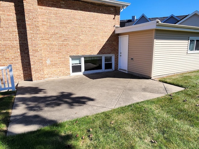 exterior space with a patio and a lawn